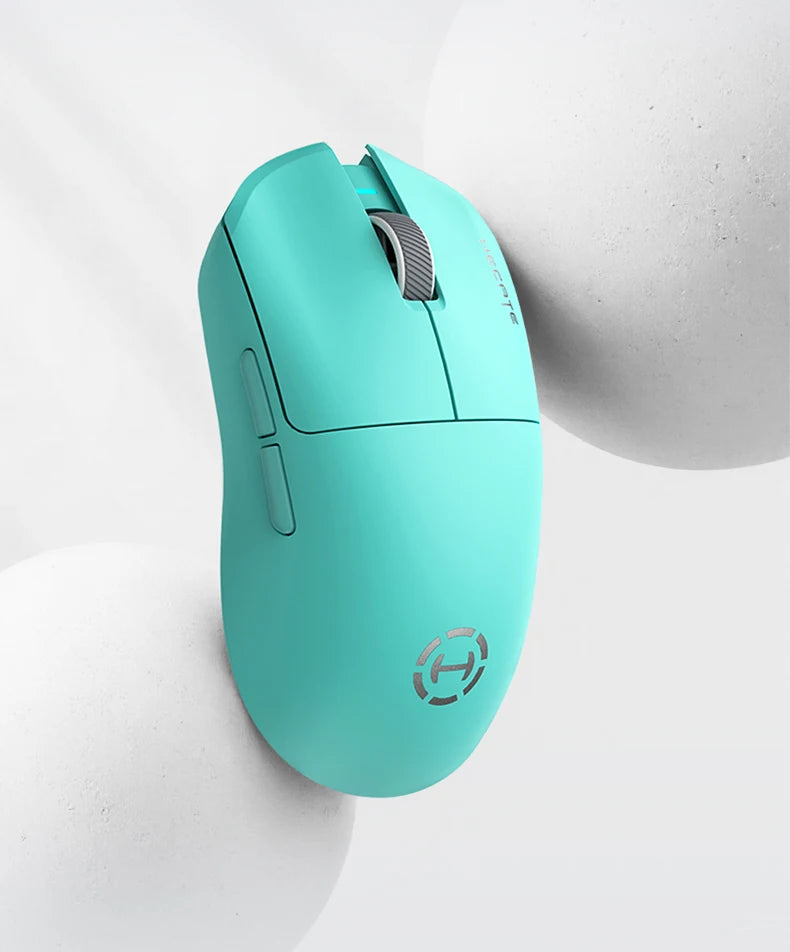 Teal gaming mouse on a light gray background
